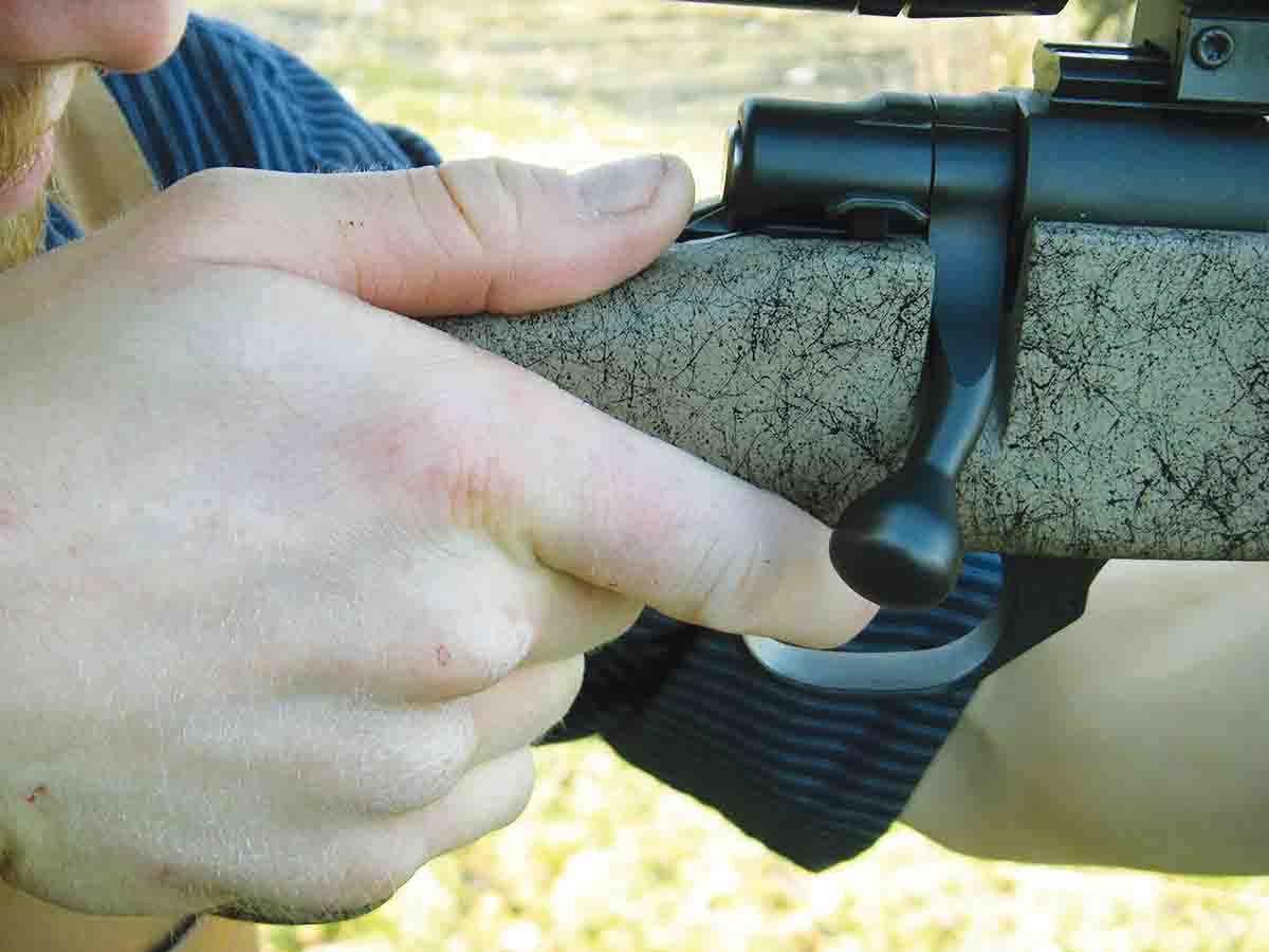 When using stocks with nearly vertical pistol grips, many shooters prefer to place the thumb just above the trigger finger.
